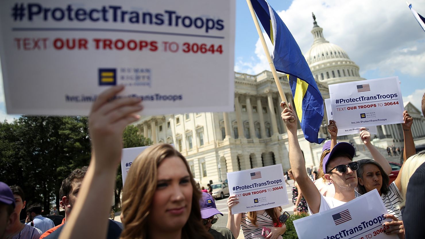 Gay rights supporters condemn a ban on transgender service members during a protest at the US Capitol on July 26, 2017 in Washington, DC.  
