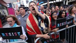 Dozens of protesters gather in Times Square near a military recruitment center to show their anger at President Donald Trump's decision to reinstate a ban on transgender individuals from serving in the military on July 26, 2017 in New York City. Trump citied the "tremendous medical costs and disruption" for his decision. 