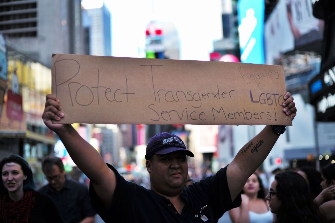 A protester displays a placard during a demonstration in New York, on July 26, 2017. 