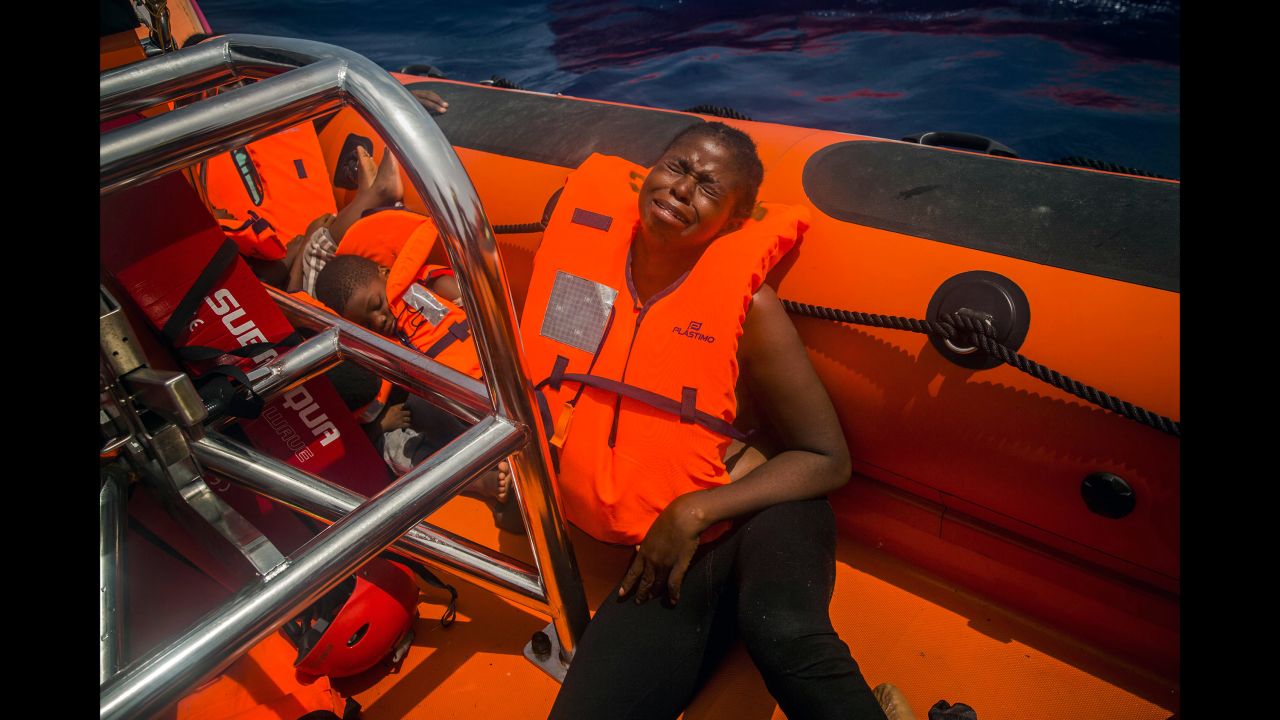 A woman cries <a href="http://www.cnn.com/2017/07/26/europe/migrant-crisis-mediterranean/index.html" target="_blank">after being rescued</a> in the Mediterranean Sea about 15 miles north of Sabratha, Libya, on July 25, 2017. More than 6,600 migrants and refugees entered Europe by sea in January 2018, <a href="https://www.iom.int/news/90-migrants-reportedly-drown-bodies-wash-libyan-shores" target="_blank" target="_blank">according to the UN migration agency</a>, and more than  240 people died on the Mediterranean Sea during that month.