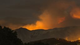 The Whittier Fire burns through the night on July 9, 2017 near Santa Barbara, California. The Whittier Fire and the Alamo Fire together have blackened more than 30,000 acres of chaparral-covered hills in Ventura County. Statewide, about 5,000 firefighters are fighting 14 large wildfires. 