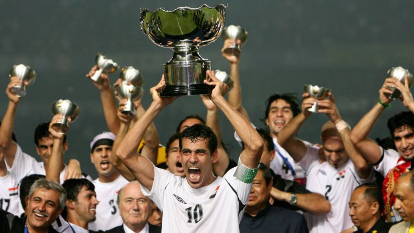 Iraq's captain Younis Mohmoud holds up the winning trophy as he along with teammates celebrate at the end of the final match of the Asian Football Cup 2007 at the Bung Karno stadium in Jakarta, 29 July 2007.