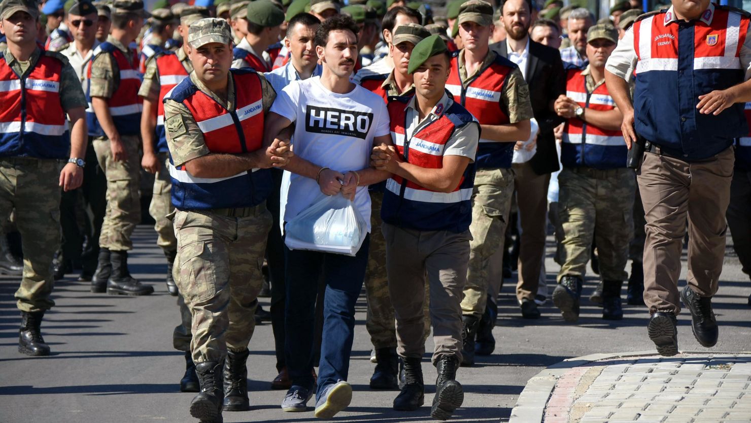 Gokhan Guclu wore the "HERO" T-shirt to his court hearing on July 13. 