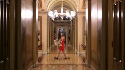 A Senate staff member carrys an armload of pizzas into the U.S. Capitol in anticipation of all-night voting July 27, 2017 in Washington, DC. Senate Republicans are working to pass a stripped-down, or 'Skinny Repeal,' version of Obamacare reform that might include repealing individual and employer mandates and tax on medical devices.  