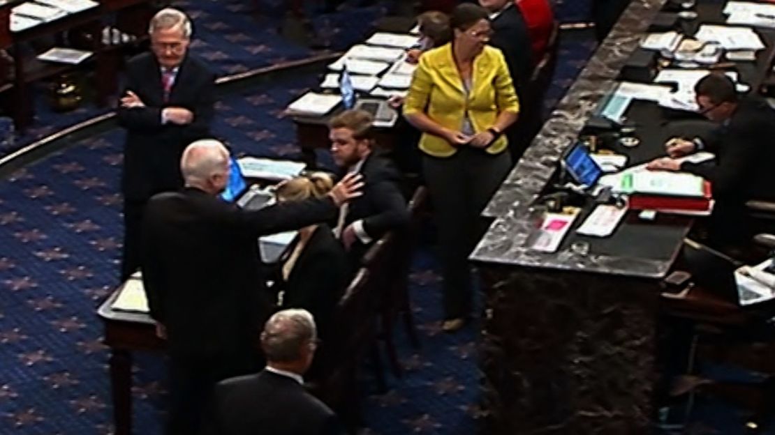 McCain gestures on the Senate floor.