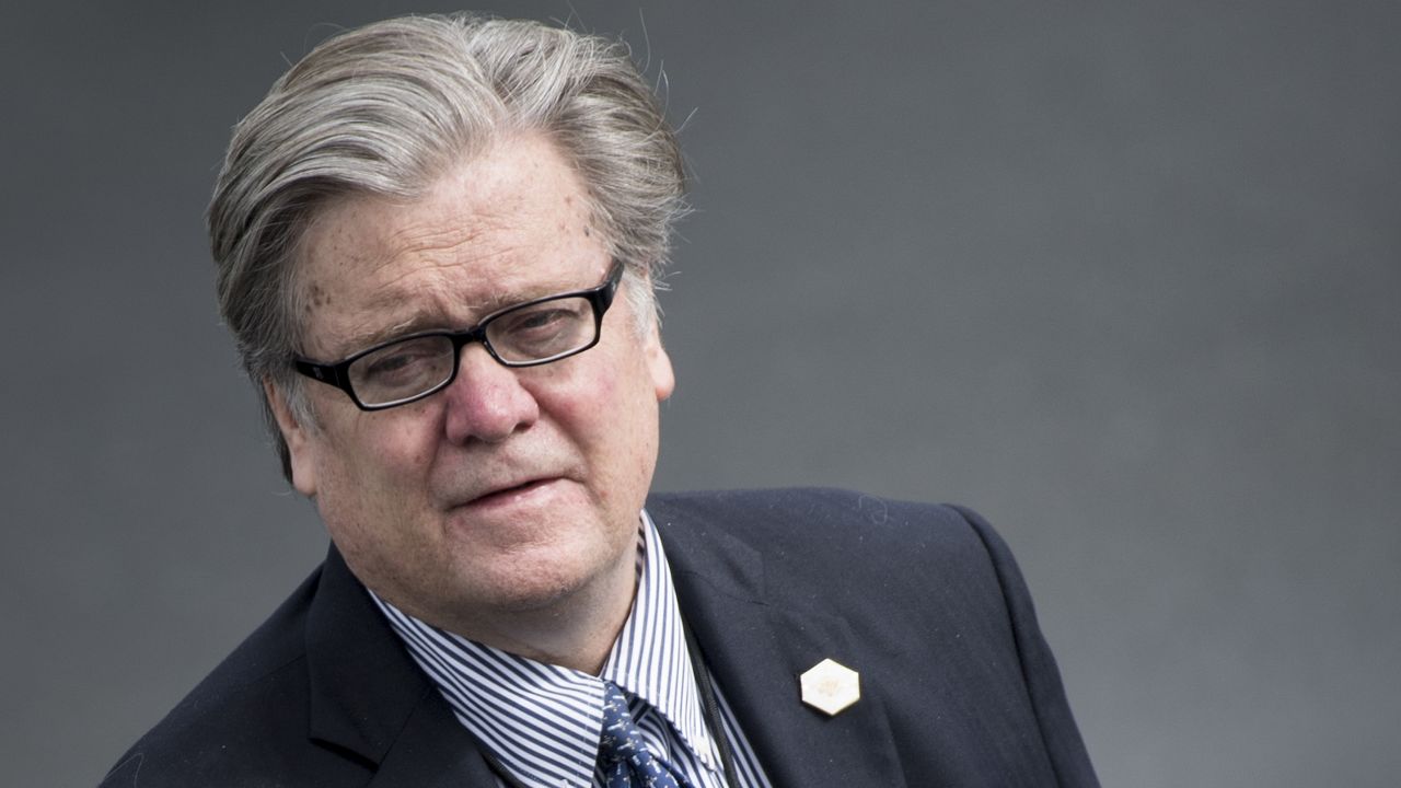 Strategist Steve Bannon waits while US President Donald Trump arrives at Lynchburg Regional Airport May 13, 2017 in Lynchburg, Virginia. / AFP PHOTO / Brendan Smialowski        (Photo credit should read BRENDAN SMIALOWSKI/AFP/Getty Images)