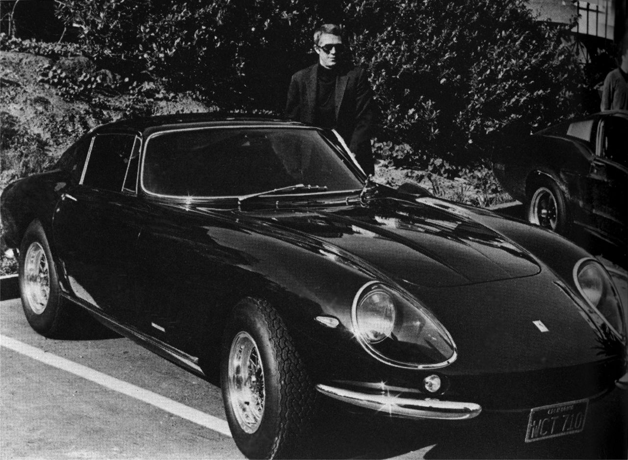 Thanks to a host of celebrity owners, the Ferrari brand was also rapidly building a reputation for elegance and style. Here, Steve McQueen stands proudly beside his Ferrari 275 GTB 4 by Scaglietti. 