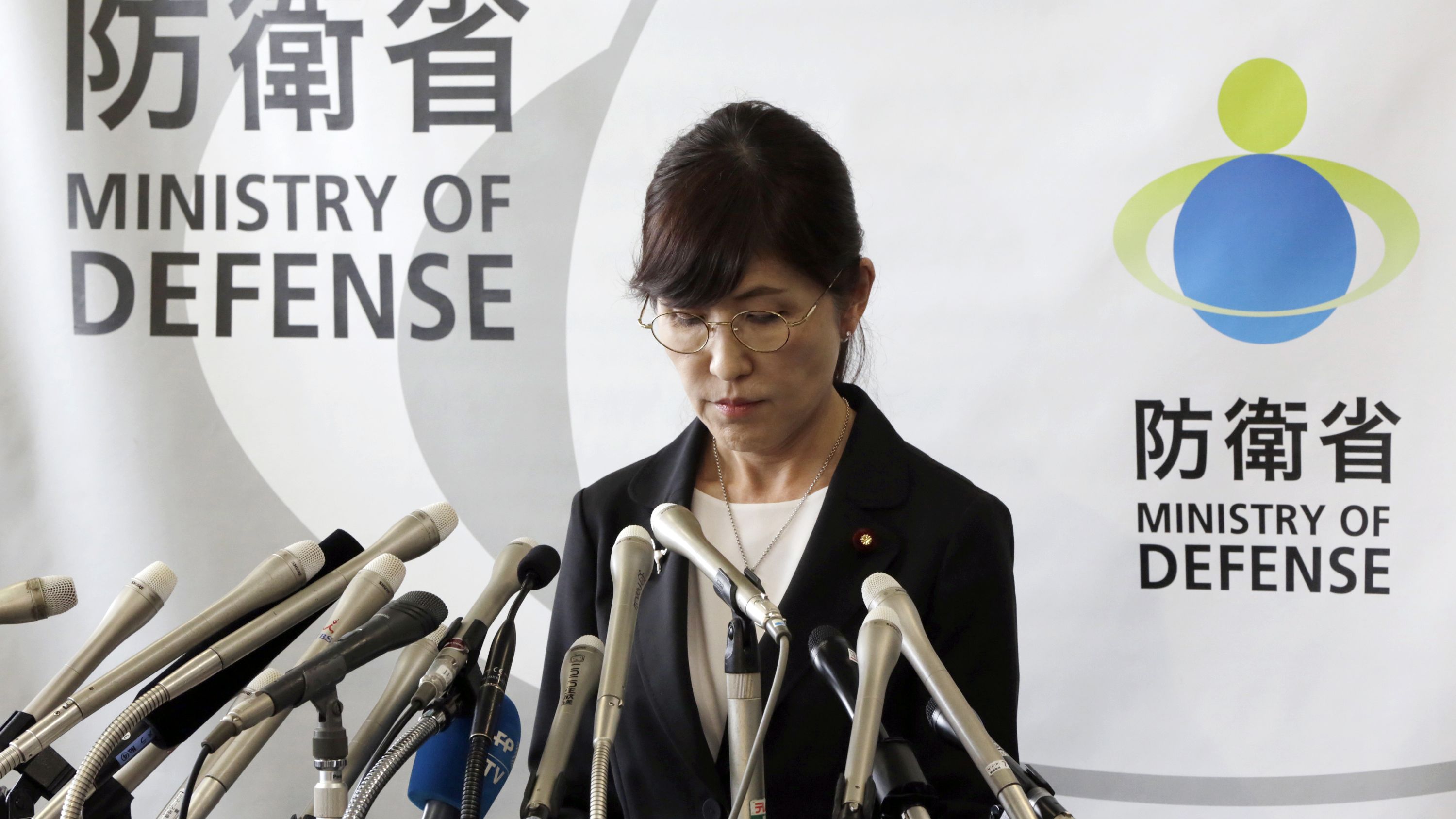 Japan's Defense Minister Tomomi Inada pauses during a news conference on her resignation.
