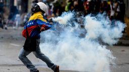 Opposition demonstrators clash with riot police ensuing an anti-government protest in Caracas, on July 26, 2017.
Venezuelans blocked off deserted streets Wednesday as a 48-hour opposition-led general strike aimed at thwarting embattled President Nicolas Maduro's controversial plans to rewrite the country's constitution got underway. / AFP PHOTO / FEDERICO PARRA        (Photo credit should read FEDERICO PARRA/AFP/Getty Images)