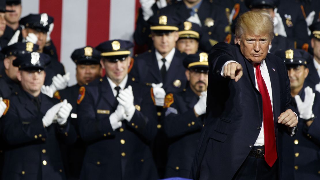 President Donald Trump points to the crowd after speaking to law enforcement officers on Friday. 