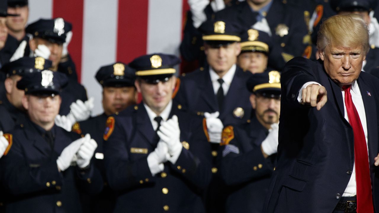 President Donald Trump points to the crowd after speaking to law enforcement officials on the street gang MS-13, Friday, July 28, 2017, in Brentwood, N.Y. 