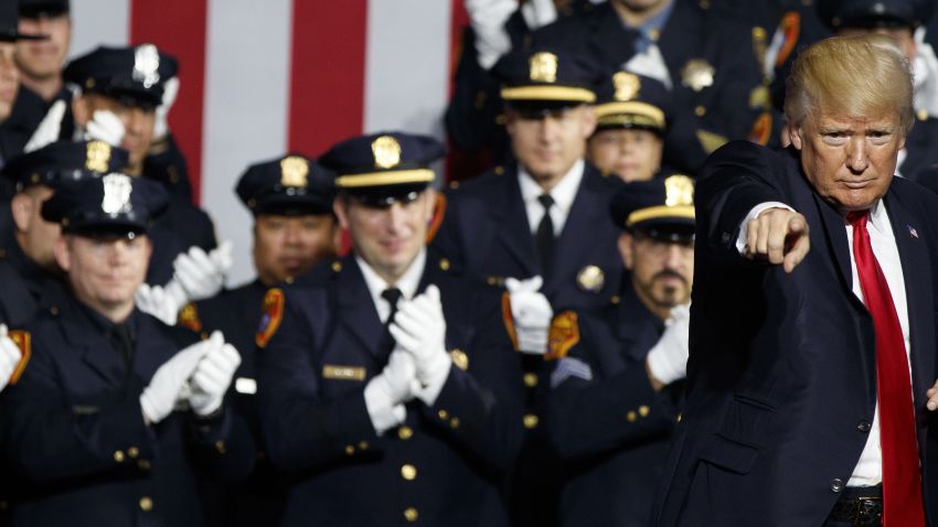 President Donald Trump points to the crowd after speaking to law enforcement officials on the street gang MS-13, Friday, July 28, 2017, in Brentwood, N.Y.