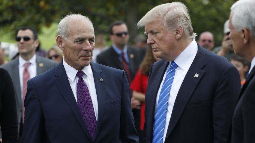 President Donald Trump stands with Secretary of Homeland Security John Kelly and Vice President Mike Pence after laying flowers on the grave of Kelly's son, First Lieutenant Robert Kelly, at Arlington National Cemetery on May 29, 2017 in Arlington, Virginia. Lt. Kelly was killed in 2010 while leading a patrol in Afghanistan.