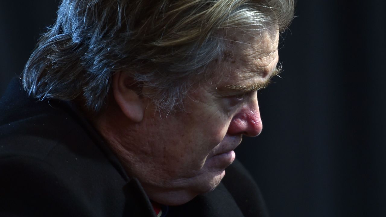 Assistant and White House chief strategist to US President Donald Trump, Steve Bannon listens as Trump delivers remarks with auto industry executives at American Center for Mobility in Ypsilanti, Michigan on March 15, 2017. / AFP PHOTO / Nicholas Kamm        (Photo credit should read NICHOLAS KAMM/AFP/Getty Images)