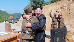 North Korean leader Kim Jong-Un celebrates the successful  of the intercontinental ballistic missile Hwasong-14 at an undisclosed location in July. 