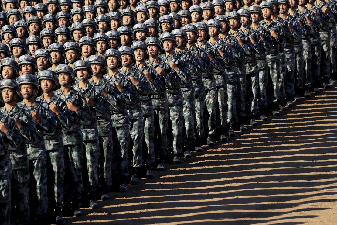 Chinese troops march in formation on Sunday. 