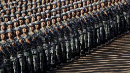 In this photo released by China's Xinhua News Agency, Chinese People's Liberation Army (PLA) troops march in formation Sunday, July 30, 2017 as they arrive for a military parade to commemorate the 90th anniversary of the founding of the PLA on Aug. 1 at Zhurihe training base in north China's Inner Mongolia Autonomous Region. (Ju Zhenhua/Xinhua via AP)