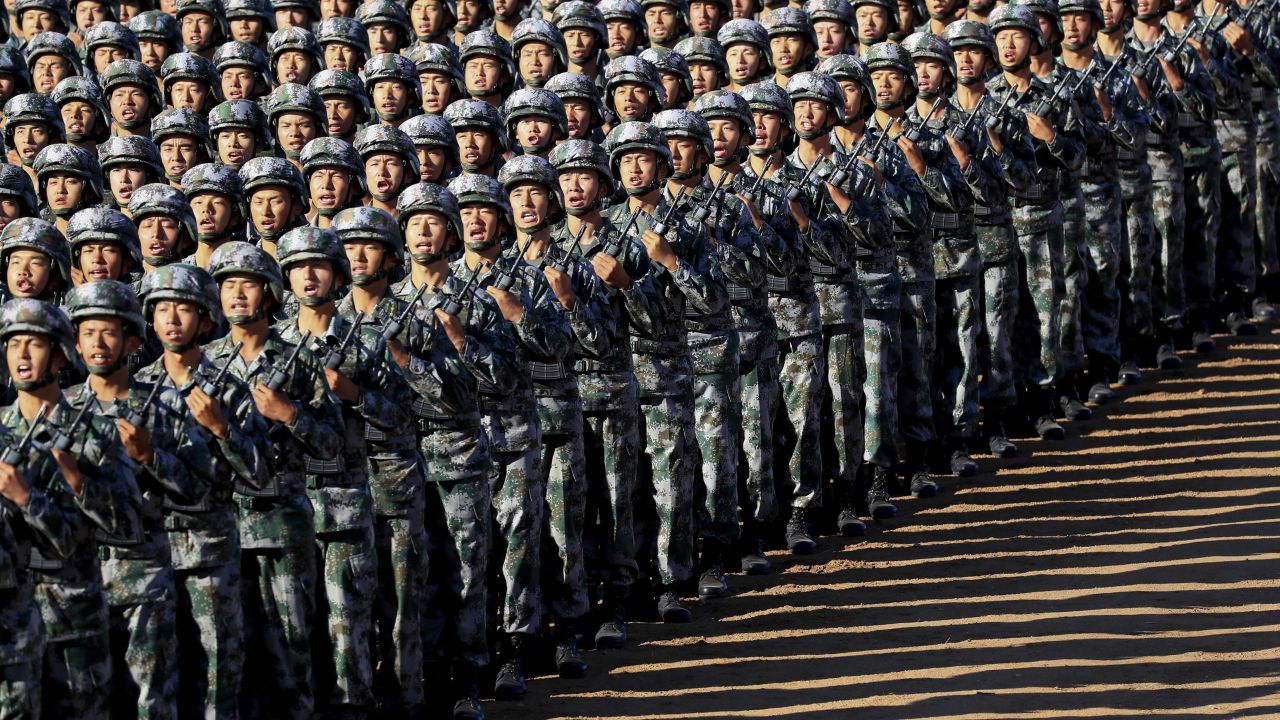 Chinese troops march in formation on Sunday.
