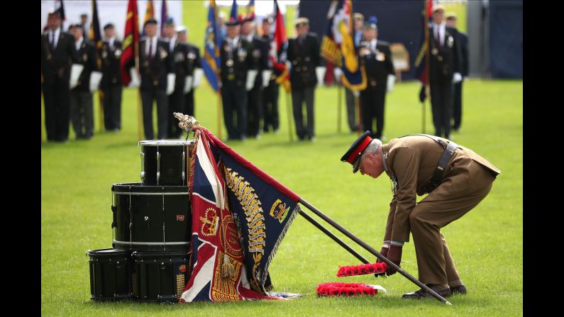 Governor of Edinburgh Castle, Maj. Gen. Mike Riddell-Webster, lays a wreath by a drum altar in Crieff.
