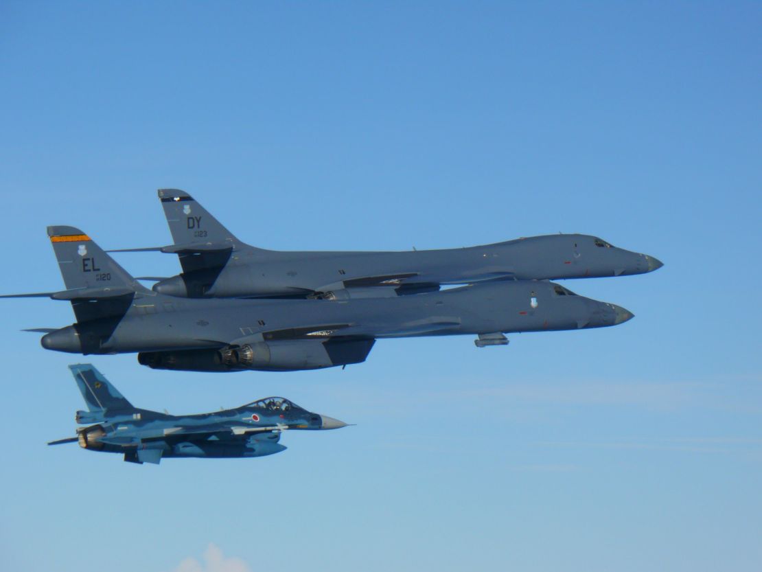 Two U.S. Air Force B-1B Lancers join a Japan Air Self-Defense Force F-2 fighter jet in a show of force after North Korea's latest missile test.