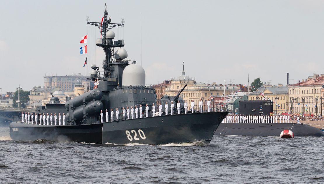 A Russian Navy vessel sails along the Neva River during the naval parade for Russia's Navy Day in St. Petersburg.