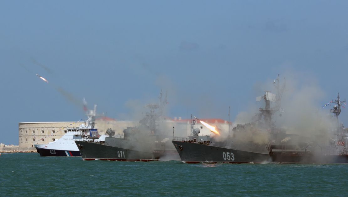 Russian navy frigates fire missiles during Russia's Navy Day celebration in Sevastopol in Crimea.