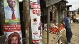 A vendor waits for customers at his tomato stall beside electoral posters in the Kibera slum in Nairobi, Kenya, on Friday, July 21, 2017. Kenya, East Africas biggest economy, has faced questions about the credibility of its past two elections, with a dispute over the outcome of a presidential vote in December 2007 triggering two months of ethnic violence that left at least 1,100 people dead.  Photographer: Riccardo Gangale/Bloomberg via Getty Images