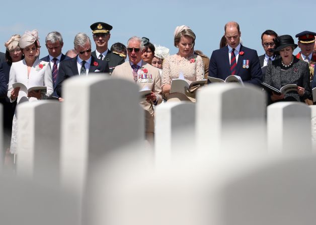 Britain's Catherine, Duchess of Cambridge, King Philippe of Belgium, Britain's Charles, Prince of Wales, Queen Mathilde of Belgium, Britain's Prince William, Duke of Cambridge and British Prime Minister Theresa May participate in the commemorations at The Tyne Cot Commonwealth War Graves Cemetery in Zonnebeke, Belgium, on Monday July 31, to mark the 100th anniversary of the Third Battle of Ypres -- one of the deadliest battles of World War I. 