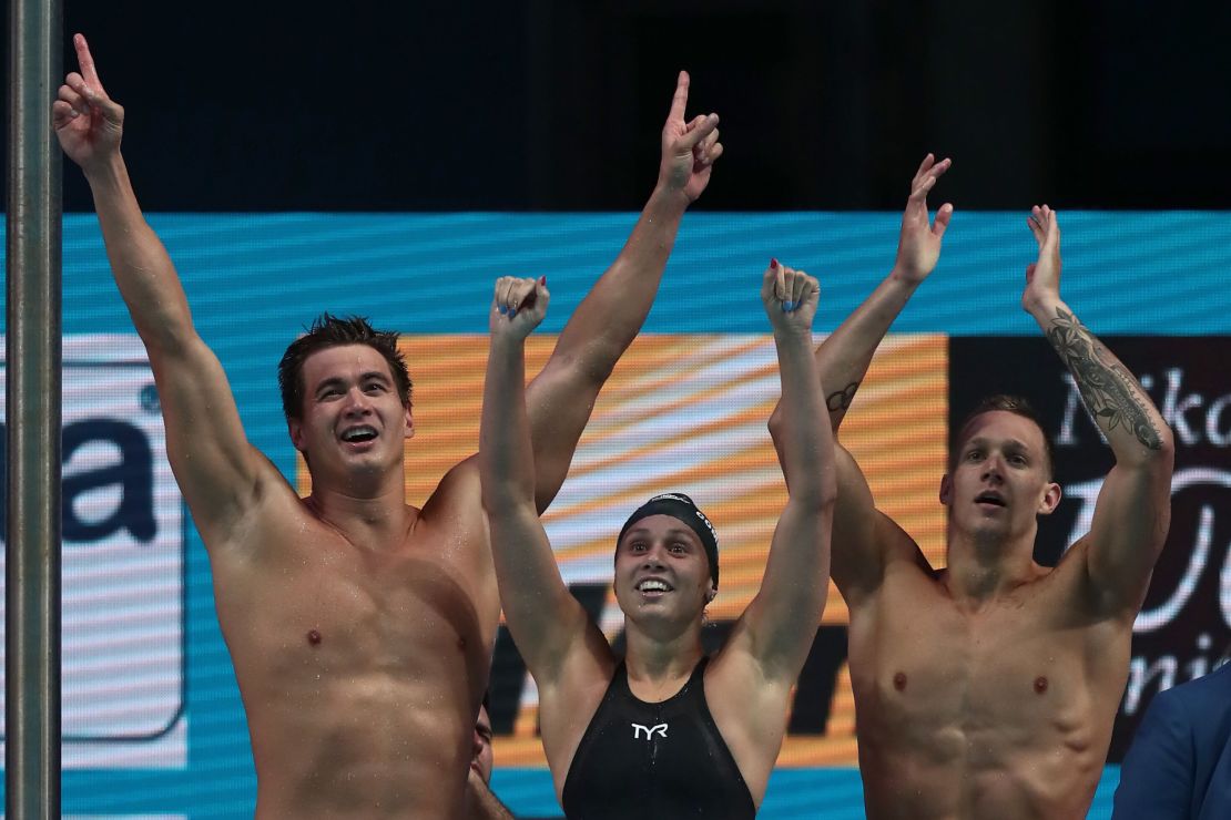 (Left to right) Nathan Adrian,Mallory Comerford and Caeleb Dressel celebrate after winning the mixed 4x100m freestyle at the World Aquatics Championships 