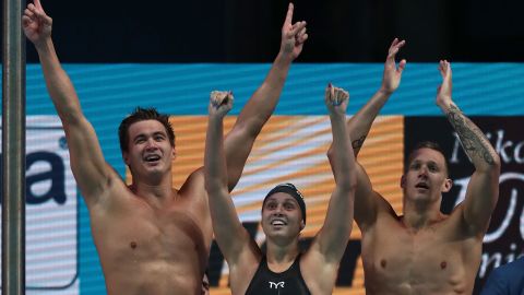 (Left to right) Nathan Adrian,Mallory Comerford and Caeleb Dressel celebrate after winning the mixed 4x100m freestyle at the World Aquatics Championships 