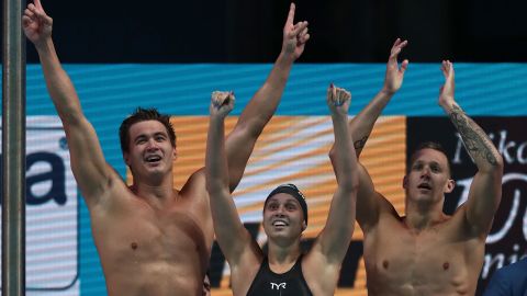 (Left to right) Nathan Adrian,Mallory Comerford and Caeleb Dressel celebrate after winning the mixed 4x100m freestyle at the World Aquatics Championships