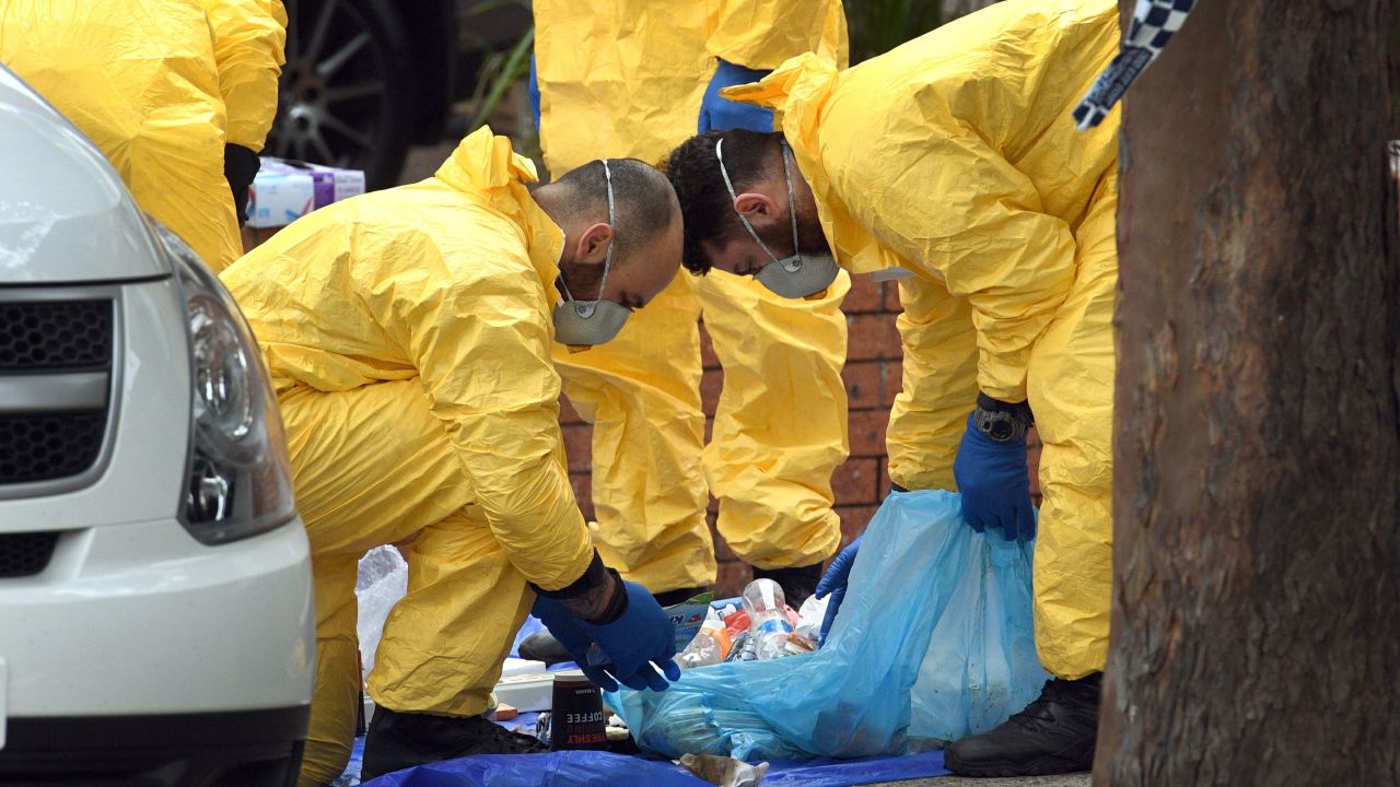 Police search for evidence at a block of flats in the Sydney suburb of Lakemba on July 31.