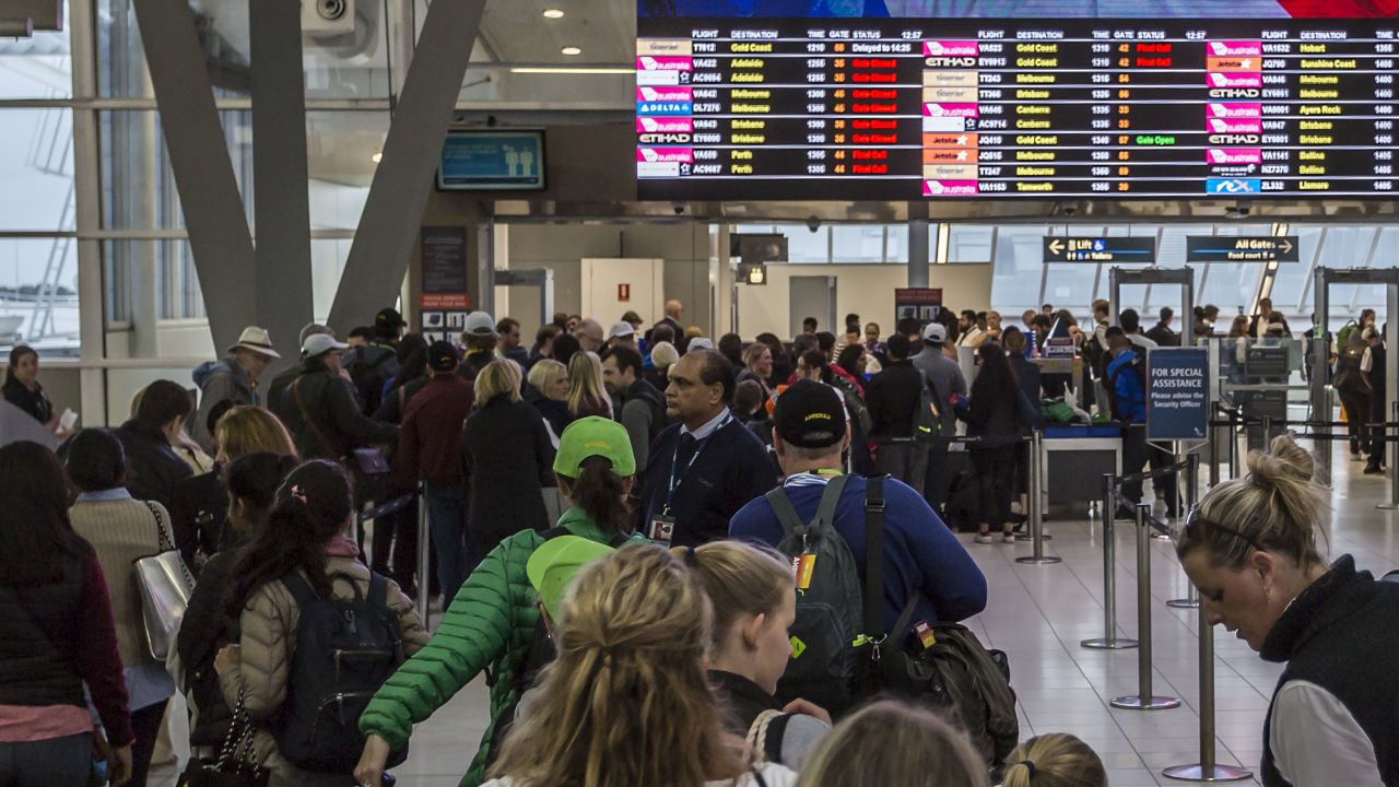 Passengers at Sydney Airport face a long wait to clear security on July 31.