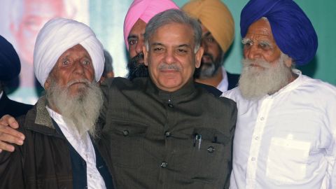 Punjab Chief Minister Muhammad Shahbaz Sharif poses with his father's friends in 2013.