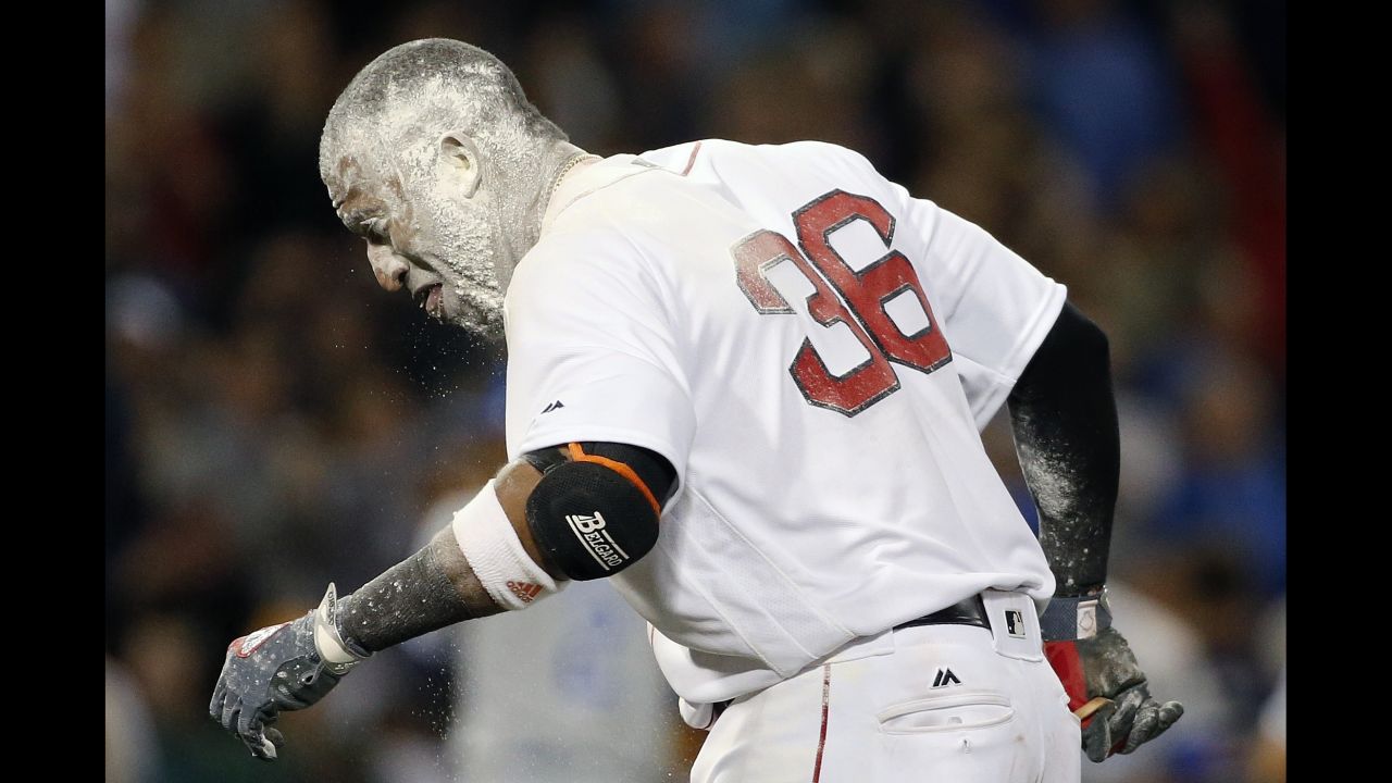 Boston second baseman Eduardo Nunez is covered in baby powder after driving in the game-winning run against Kansas City on Saturday, July 29. His teammates threw the powder on him during the celebration.