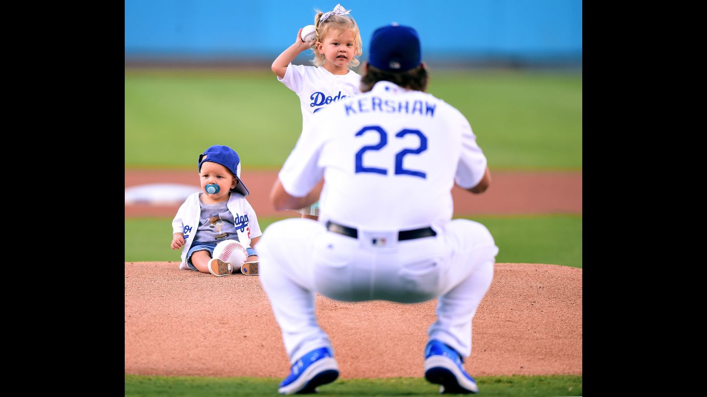 Cali Ann Kershaw throws out the first pitch to her father, Los Angeles Dodgers ace Clayton Kershaw, before a home game on Wednesday, July 26. Sitting on the mound is Cali Ann's brother, Charley Kershaw.