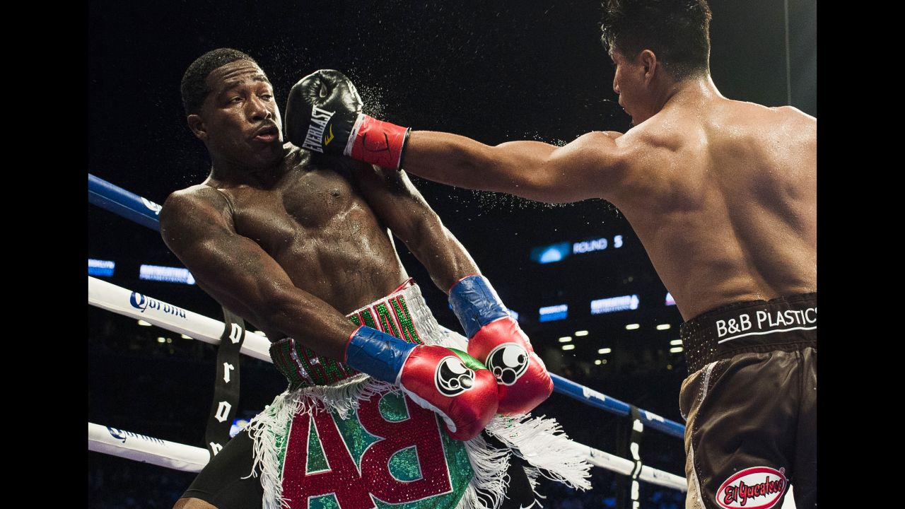 Mikey Garcia punches Adrien Broner during their junior-welterweight bout in New York on Saturday, July 29. Garcia won by unanimous decision and remains undefeated in his professional career (37-0).