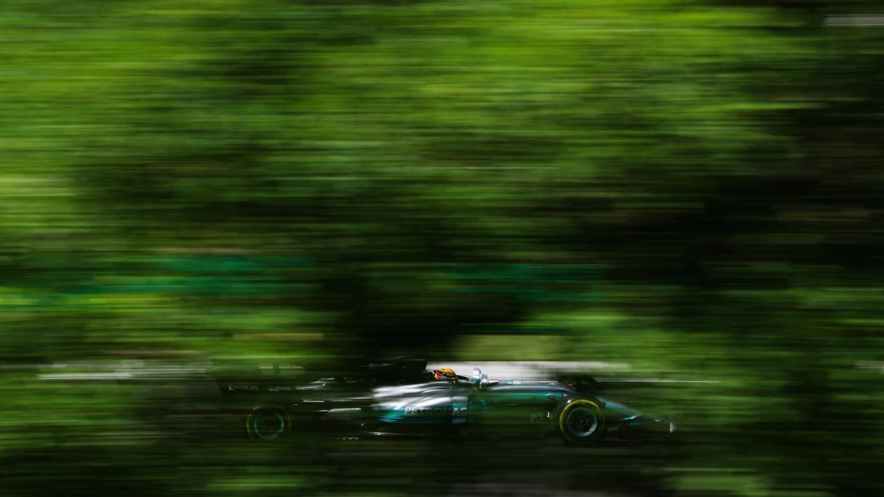 Formula One driver Lewis Hamilton whizzes by Friday, July 28, during a practice run at the Hungarian Grand Prix.