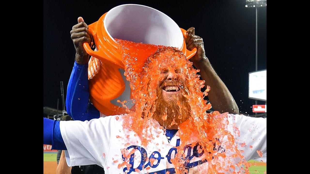 Justin Turner, third baseman for the Los Angeles Dodgers, is doused with Gatorade after hitting a walk-off single against Minnesota on Friday, July 28.