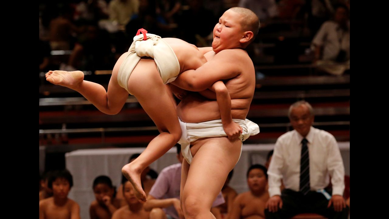 Elementary school sumo wrestlers compete at the Wanpaku tournament in Tokyo on Sunday, July 30.