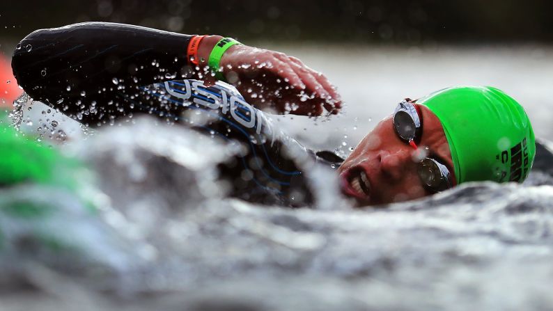 A triathlete swims during the Ironman Canada event on Sunday, July 30.
