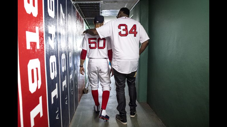 Former Boston Red Sox star David Ortiz, right, walks with current Red Sox star Mookie Betts before a game at Fenway Park on Sunday, July 30. Ortiz was attending a reunion of the 2007 team that won the World Series. <a href="index.php?page=&url=http%3A%2F%2Fwww.cnn.com%2F2017%2F07%2F24%2Fsport%2Fgallery%2Fwhat-a-shot-sports-0725%2Findex.html" target="_blank">See 27 amazing sports photos from last week</a>