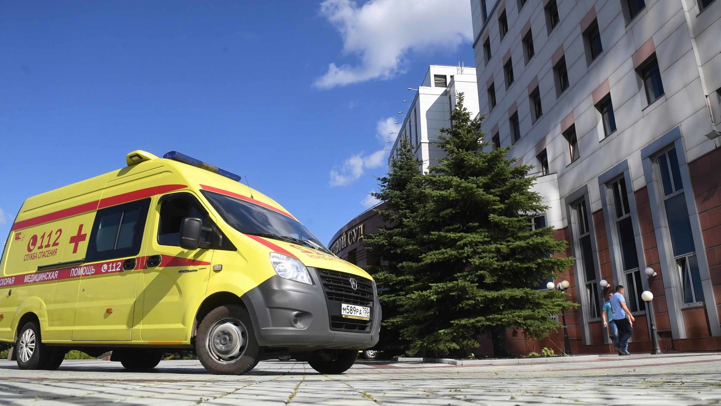 An ambulance arrives at the Moscow Region Court after gangsters opened fire Tuesday.