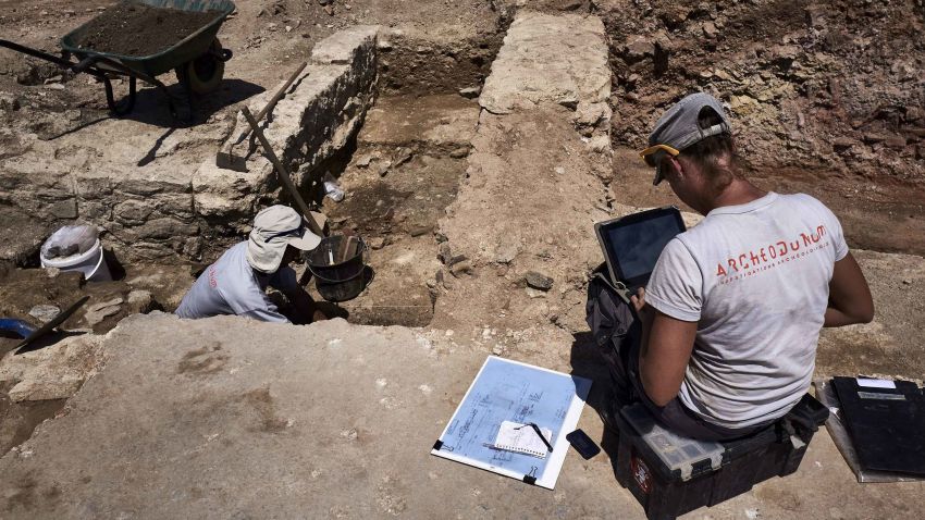 Archaeologists  works  on July 31, 2017, on the archaeological antiquity site of Sainte-Colombe, near Vienne, eastern France.
Remains of an entire neighbourhood of the Roman city of Vienne have been uncovered in Sainte-Colombe, with lavish residences decorated with mosaics, a philosophy school and shops. The dig of the site, discovered prior to housing construction on a parcel of 5000 m2, began in April 2017 and was due to last six months, but have been extended to December 15, 2017, after the site was classified as an "exceptional discovery" by the French Culture Minsitry. / AFP PHOTO / JEAN-PHILIPPE KSIAZEK        (Photo credit should read JEAN-PHILIPPE KSIAZEK/AFP/Getty Images)