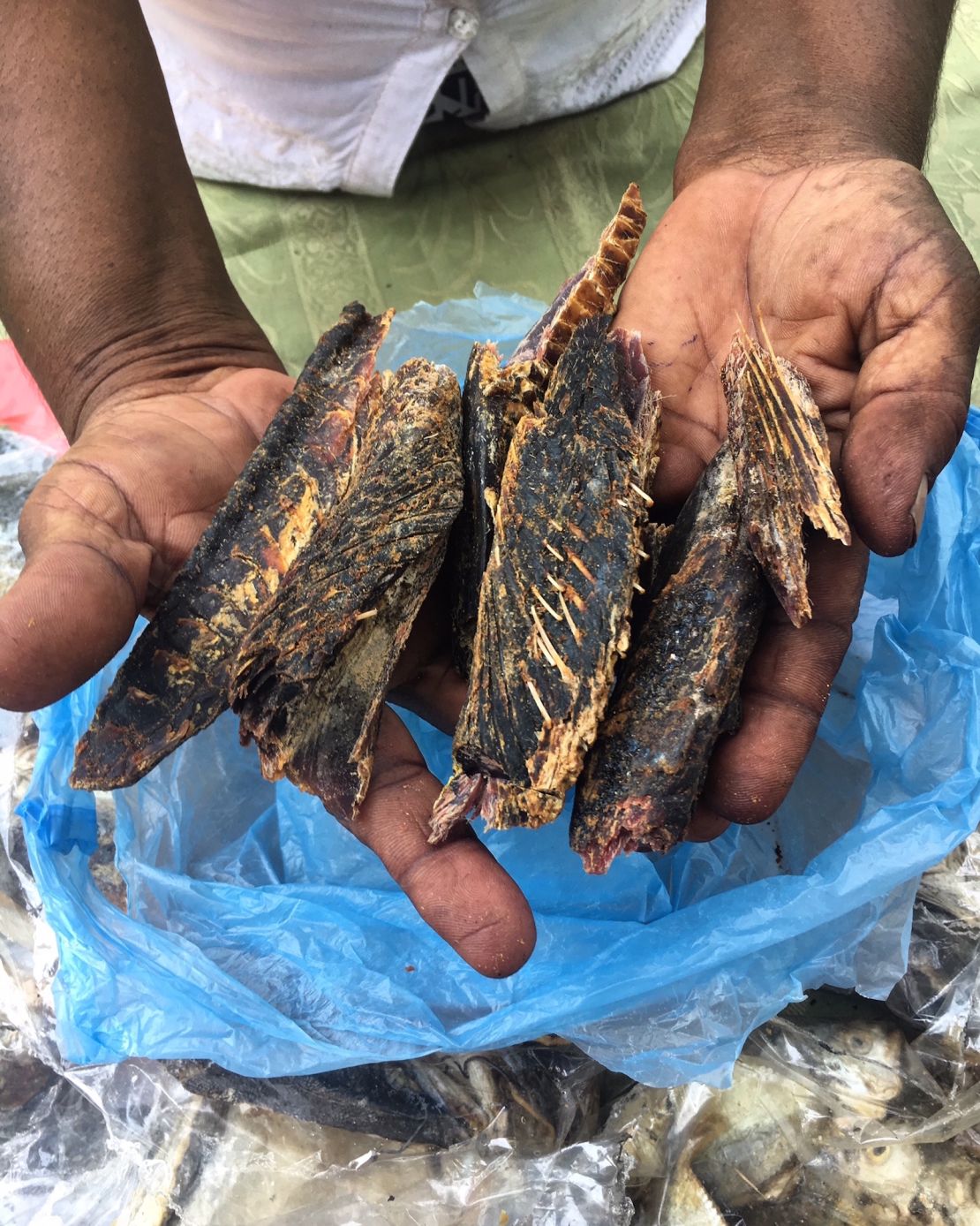Loan recipient selling dried fish at market in Chilaw