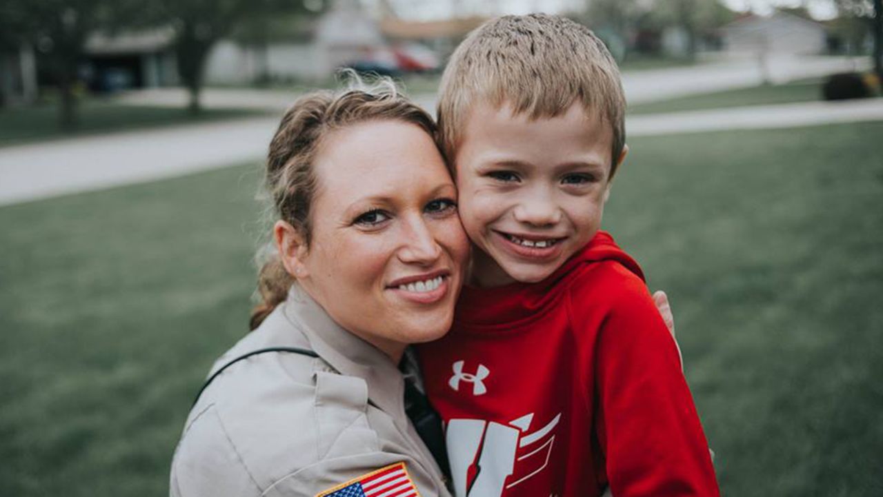 Lindsey, 31, poses with Jackson, now 9, outside his grandparents home the day she told him she would give him one of her kidneys.