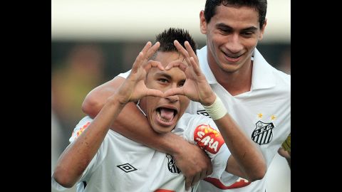 Neymar makes a heart gesture after scoring a goal for Santos in August 2010. That season, he scored 42 goals in all club competitions.