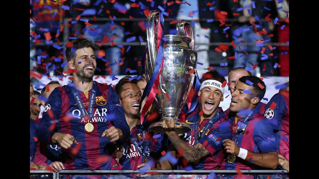 Neymar lifts the trophy after Barcelona won the Champions League in June 2015. It completed a historic treble for the Spanish club, which also won the league and the Copa del Rey that season.