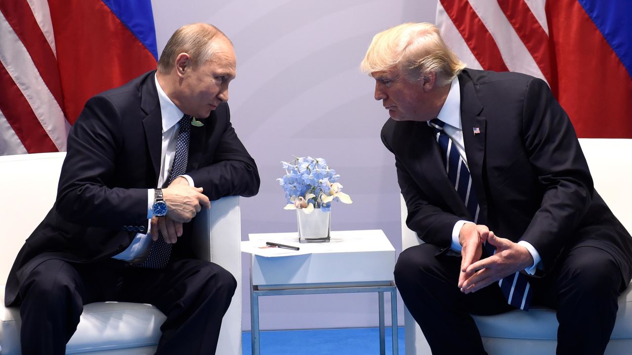 US President Donald Trump and Russia's President Vladimir Putin hold a meeting on the sidelines of the G20 Summit in Hamburg, Germany, on July 7, 2017. / AFP PHOTO / SAUL LOEB        (Photo credit should read SAUL LOEB/AFP/Getty Images)