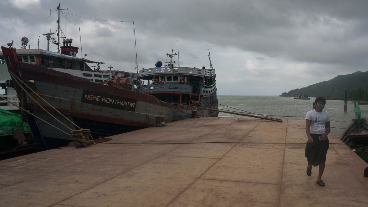 A sailor walks from a boat that crosses the Naf River daily, taking goods between Myanmar and Bangladesh. Yaba methamphetamine pills are often hidden in cases of ginger or dried fish, former user Kashem told CNN.